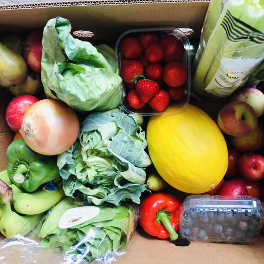 Everything Box with strawberries, apples, blueberries, melon, peppers, onion, lettuce, pears, celery, nectarines, peaches, bananas and cabbage